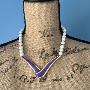 Vintage white acrylic beaded with a purple enamel focal point necklace 16”